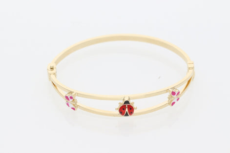 A 14K Real Gold bangle with ladybug charm  and two butterfly small charms on
