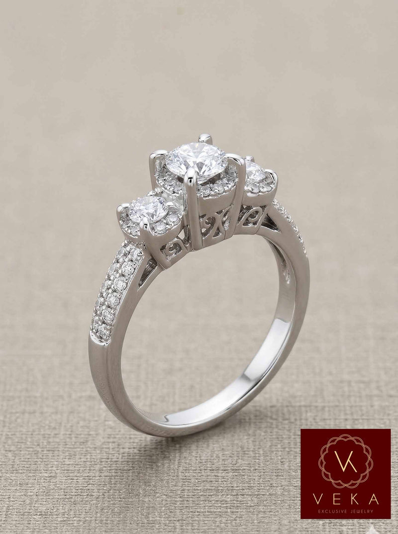 Top-down view of a three-stone engagement ring featuring 80 micro-pavé diamonds on a 14K white gold band