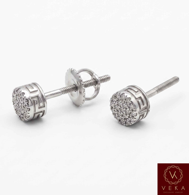Close-up flat lay photo of a pair of 10K White Gold 0.06 ctw natural diamond cluster screw-back earrings showing the Greek key pattern and secure threaded posts. By Veka Jewelry