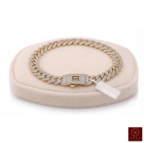 Real 10K gold Monaco Chain Edge full pavé diamond bracelet (13.5mm width) resting on a cream velvet presentation stand from Veka Jewelry.
