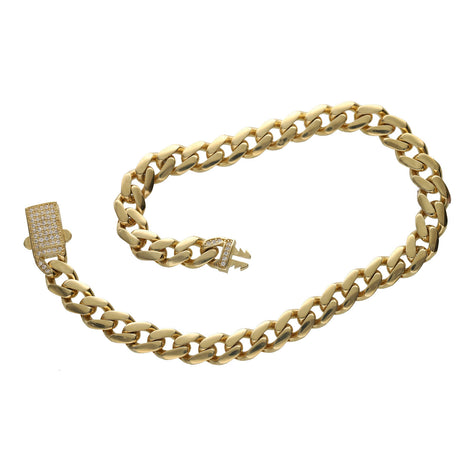 A 10 karat gold cuban link monaco style anklet with a zirconia stone push to open clasp.