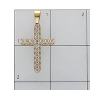 Product scale photo showing the cross pendant positioned on an inch-grid ruler to verify its 44.2 mm height and 24.3 mm width dimensions.