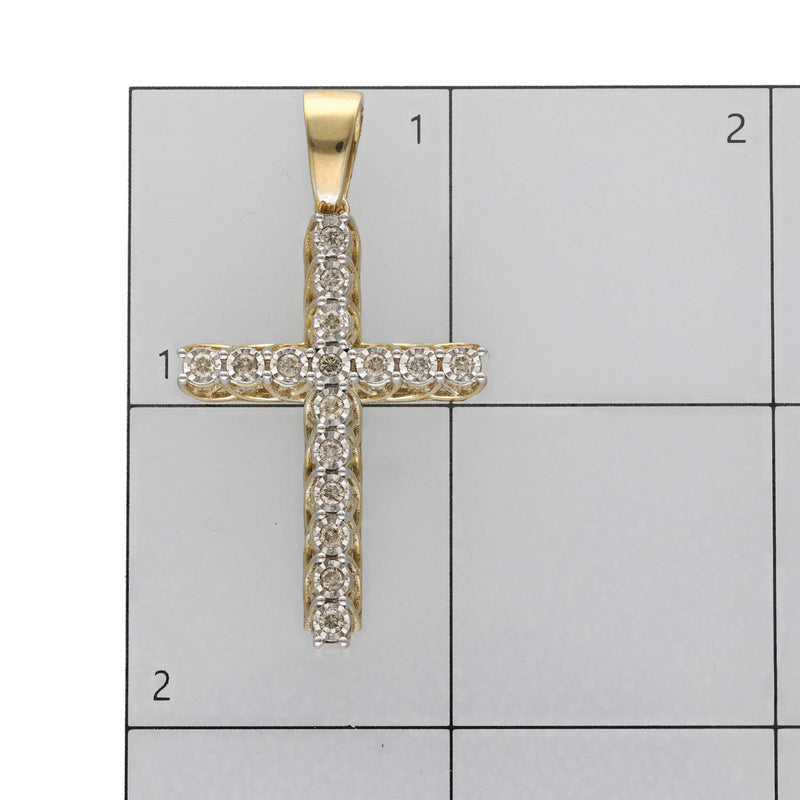 Product scale photo showing the cross pendant positioned on an inch-grid ruler to verify its 44.2 mm height and 24.3 mm width dimensions.