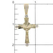 10K gold Jesus Christ crucifix cross pendant with cubic zirconia stones on a grid to have a size reference