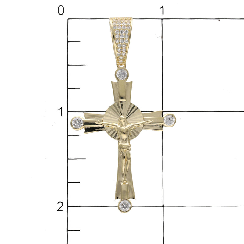 10K gold Jesus Christ crucifix cross pendant with cubic zirconia stones on a grid to have a size reference