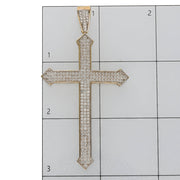 10K gold arrow edge cross pendant close-up showing CZ stones and pointed tips on a ruled grid to have a size reference