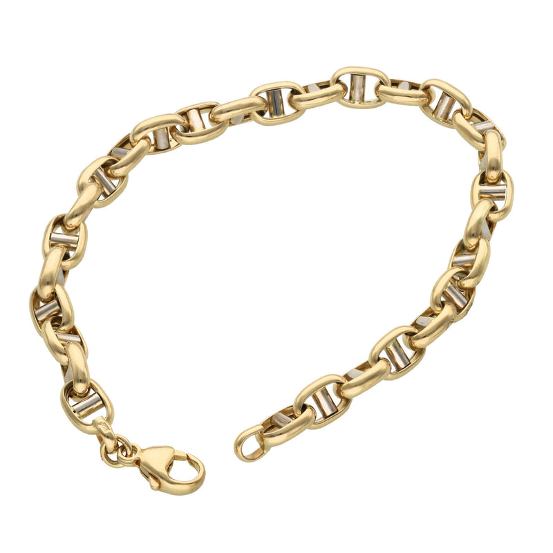 10 Karat two tone gold puffed mariner link bracelet, 6.3mm width, laying on a white background