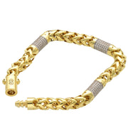 Angled view of an open 10k yellow gold Franco link bracelet showing the intricate weave and sparkling stone barrels.
