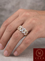 Detailed view of natural baguette and round brilliant diamonds on a 10K gold Cuban link band