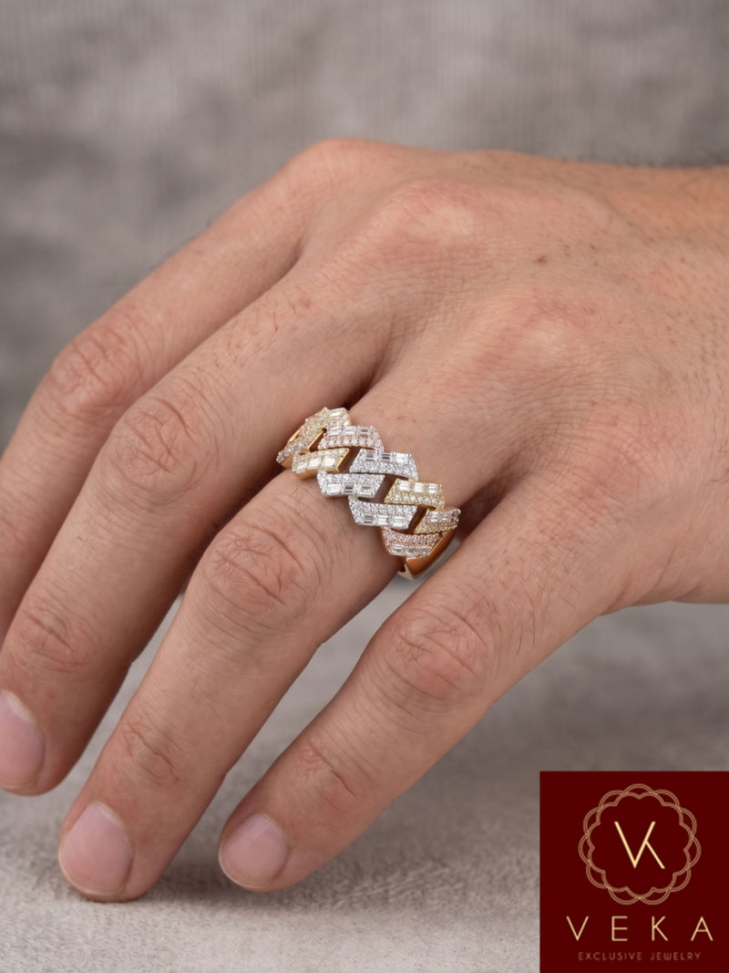Detailed view of natural baguette and round brilliant diamonds on a 10K gold Cuban link band