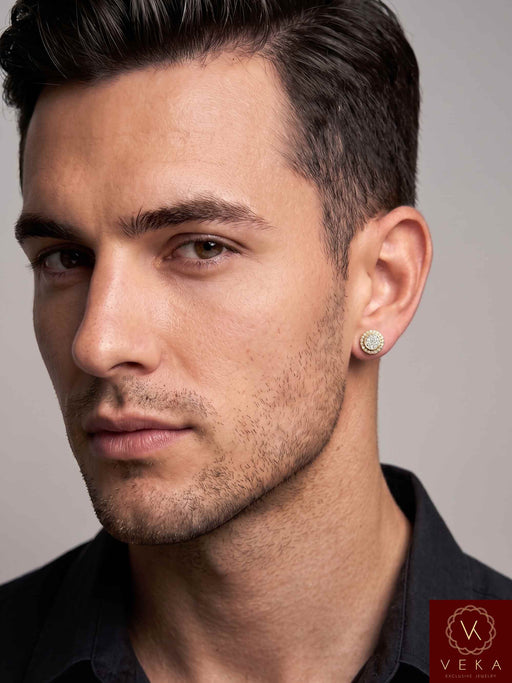 Side profile of a handsome male model wearing an 8mm 10K yellow gold natural diamond halo stud earring on his ear lobe