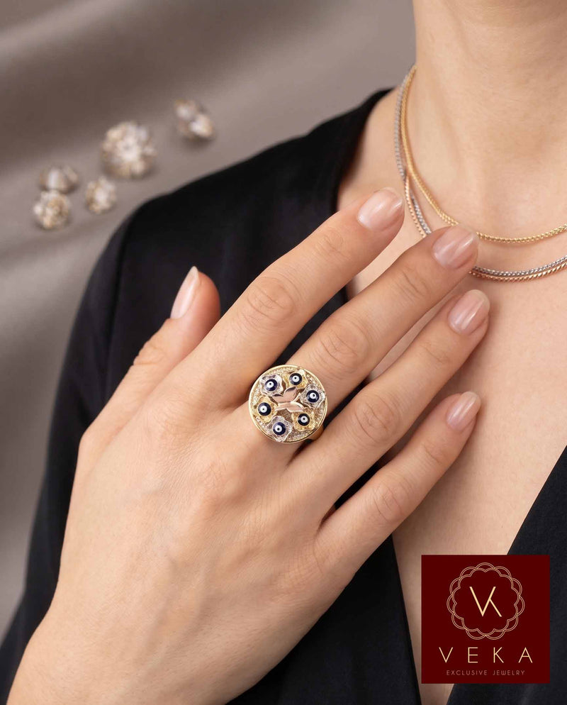 Professional model wearing a Protective 10K Gold Evil Eye Butterfly Ring, elegant fine jewelry for protection and transformation.