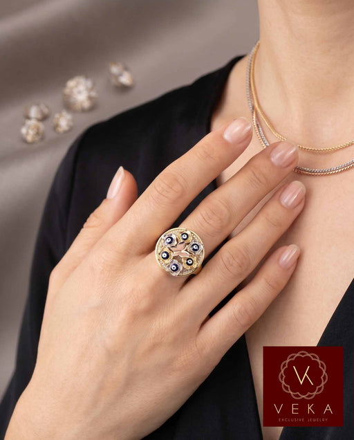 Professional model wearing a Protective 10K Gold Evil Eye Butterfly Ring, elegant fine jewelry for protection and transformation.