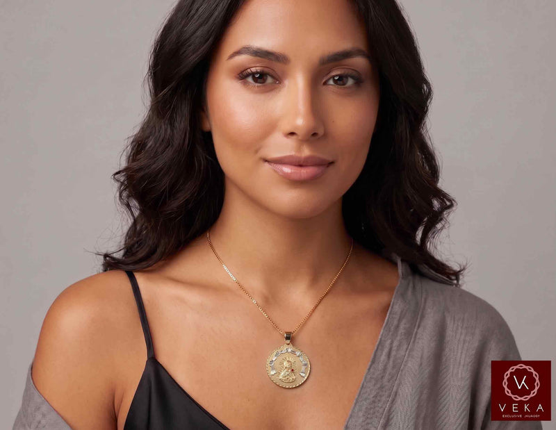Women's 10K two-tone gold Santa Barbara religious charm necklace worn on model showcasing neckline drop by Veka Jewelry