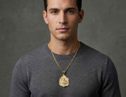 Man wearing 10K yellow gold Santa Barbara religious pendant necklace with Cuban chain