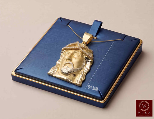 10K solid yellow gold Jesus face pendant with cubic zirconia crown displayed on a navy luxury box showing 63 mm height by Veka Jewelry