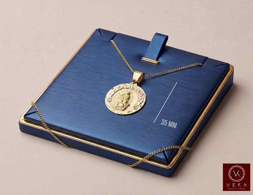 10K two-tone yellow and white gold Saint Lazarus religious medal pendant displayed on luxury blue satin stand by Veka Jewelry