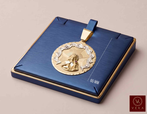 10K two-tone gold Santa Barbara medallion pendant on a luxury navy blue display tray showcasing the 65 mm total height measurement at Veka Jewelry
