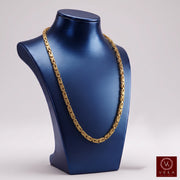 10K yellow gold 3mm byzantine chain necklace displayed on a metallic blue jewelry bust by Veka Jewelry.