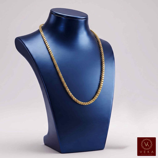 10K yellow gold hollow Franco chain necklace displayed on a metallic blue bust by Veka Jewelry