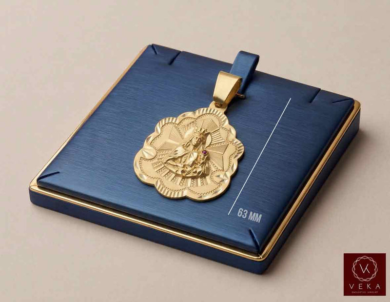 10K yellow gold Santa Barbara religious charm pendant with CZ accent displayed on luxury navy tray by Veka Jewelry