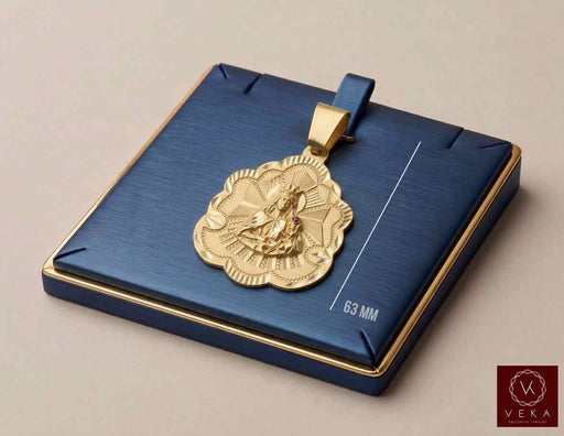 10K yellow gold Santa Barbara religious charm pendant with CZ accent displayed on luxury navy tray by Veka Jewelry