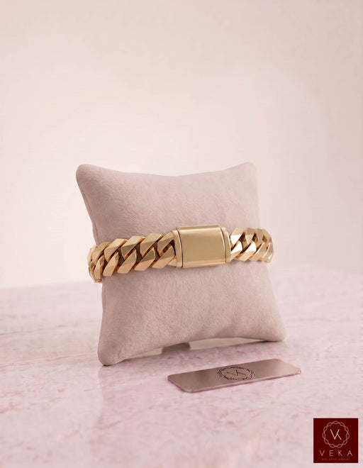 Solid 10K yellow gold 12mm Double Miami Cuban Marquise bracelet displayed on a premium presentation pillow by Veka Jewelry.