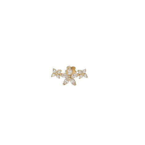 Gold and crystal flower-shaped cartilage piercing on a white background