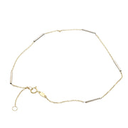 A two-tone 14 karat gold rolo anklet bracelet with a chain-link design and a lobster clasp closure.