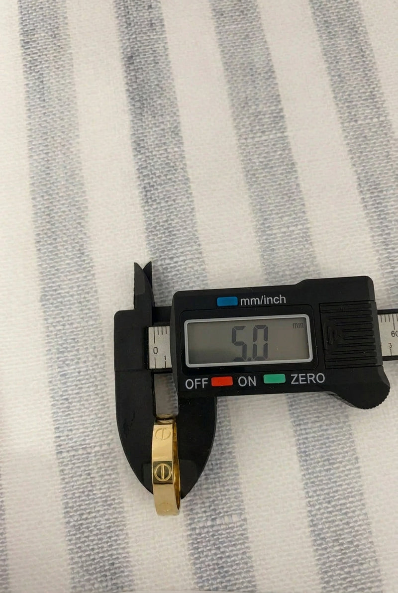 5 MM Thickness on a reader on the band listed.