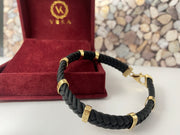 Luxury 14K yellow gold braided black leather men's bracelet presented in red VEKA Jewelry gift box