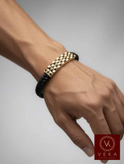 Close-up of 14K solid gold crossed chain design on black braided leather men's bracelet – premium luxury adjustable bracelet