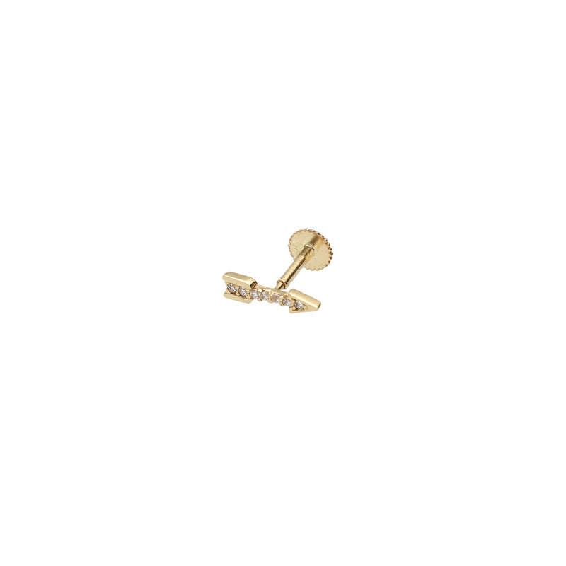 Close-up of a  14k gold arrow flat back stud with cubic zirconia in a helix piercing. Internally threaded cartilage jewelry by VEKA Jewelry.