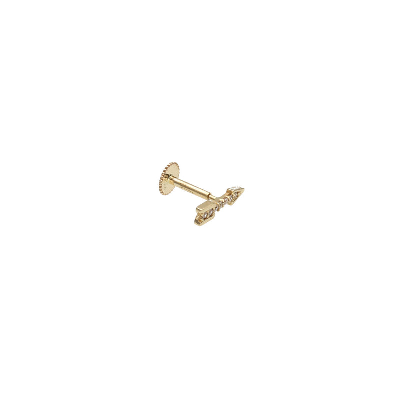 Close-up of a model wearing a 14k gold arrow flat back stud with cubic zirconia in a helix piercing. Internally threaded cartilage jewelry by VEKA Jewelry.