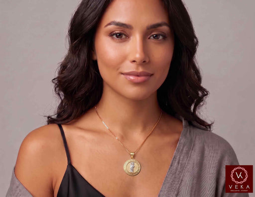 Model wearing 14K two-tone gold Saint Jude Thaddeus round medal pendant on a gold necklace