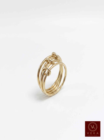 14k solid gold 4-band linked fidget stacking ring on white background by Veka Jewelry