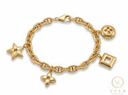 14K solid yellow gold 6mm mariner link charm bracelet with 4 attached station charms on white background - Veka Jewelry.