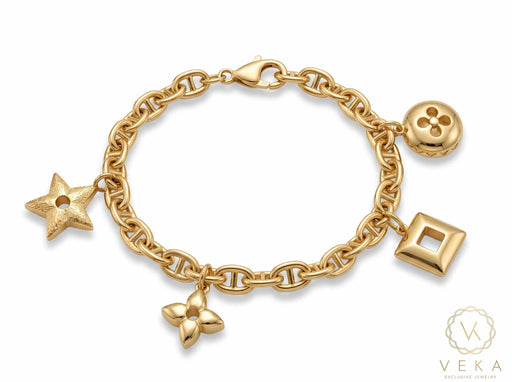 14K solid yellow gold 6mm mariner link charm bracelet with 4 attached station charms on white background - Veka Jewelry.