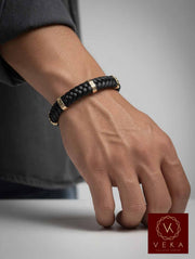 14K solid yellow gold braided black leather bracelet for men worn on wrist – luxury adjustable men's bracelet by VEKA Jewelry