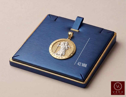 Shopify SEO Alt Text: 14K two-tone gold Saint Christopher Pray for Us medal pendant measuring 42 mm displayed in a luxury blue jewelry box by Veka Jewelry