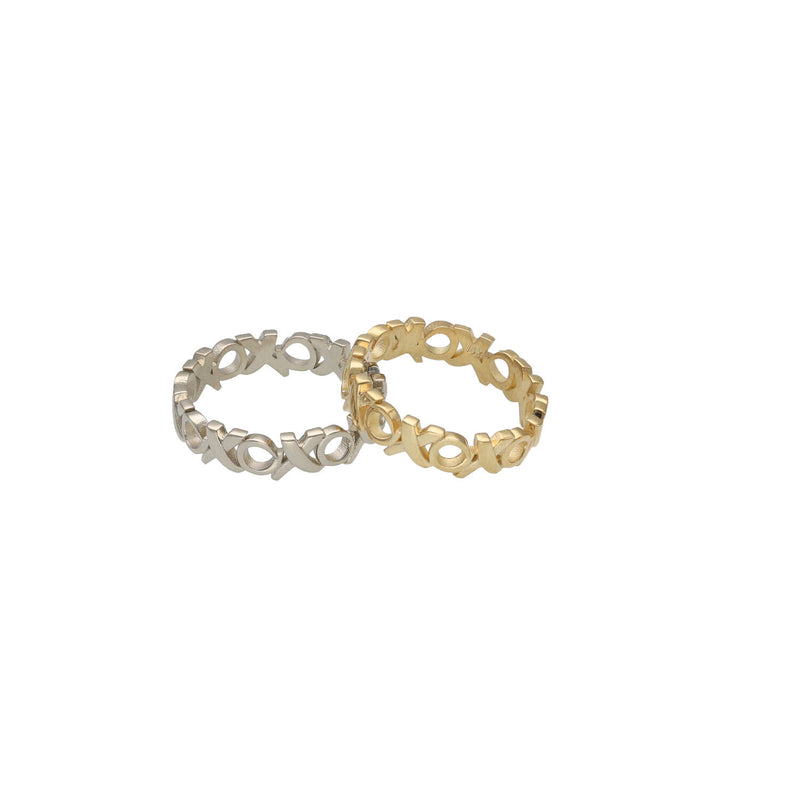 Two rings, one gold and one white gold, on a white background