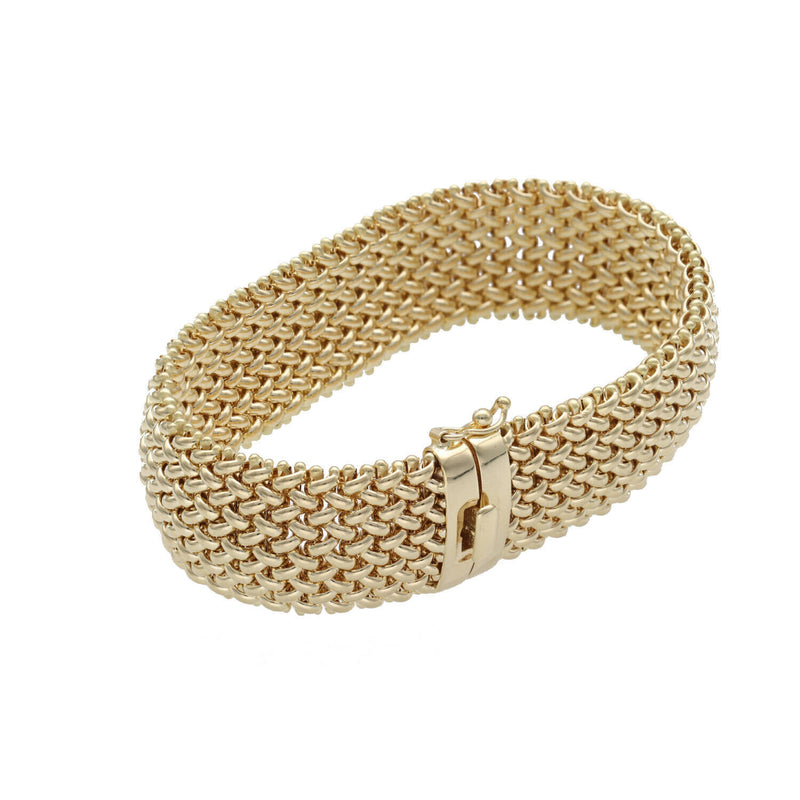 Side angle picture of a masterpiece of texture and light. This 18mm popcorn-style bracelet is crafted in genuine 14k yellow gold, weighing a substantial 22.3 grams. Finished with a high-security fancy box lock, it offers a bold look for the modern woman who values classic craftsmanship. 