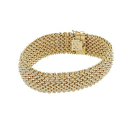 Inside and outside view of A masterpiece of texture and light. This 18mm popcorn-style bracelet is crafted in genuine 14k yellow gold, weighing a substantial 22.3 grams. Finished with a high-security fancy box lock, it offers a bold look for the modern woman who values classic craftsmanship.