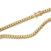 A close-up shot focusing on the sleek Box lock cylinder clasp mechanism with its dual safety latches, securely attaching one end of the 4mm 14K yellow gold hollow Franco chain 
