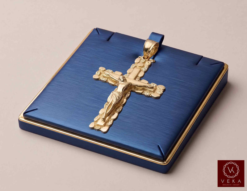 14K solid yellow gold nugget Jesus Christ crucifix pendant presented on a luxury blue display tray by Veka Jewelry.
