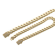 A 14 karat gold cuban link monaco style anklet with a CZ lock, displayed on a qhite background.