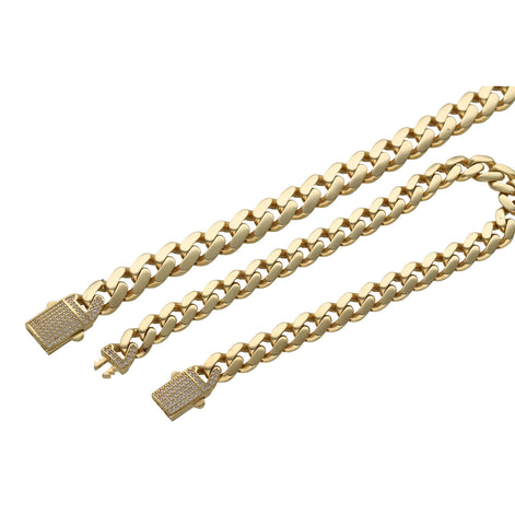 A 14 karat gold cuban link monaco style anklet with a CZ lock, displayed on a qhite background.