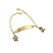 A 14 karat gold ID baby bracelet with a Cuban link chain design, featuring taz and Sylvester kitty charm, and a customizable ID plate.