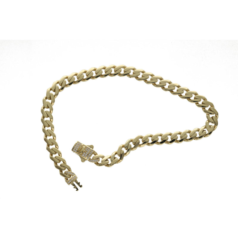 A 14 karat gold anklet with clear zirconia stones with the word ROMA, featuring a Cuban-link design shown on a qhite background.