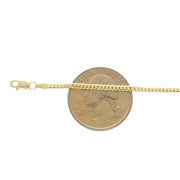 Anklet in 14k Solid Yellow Gold in the iconic Miami Cuban Link style  next to 25 cent coin.